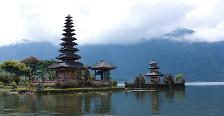 Lake Bratan, high up in the central mountains of Bali, is famous for its lakeside templeの写真素材