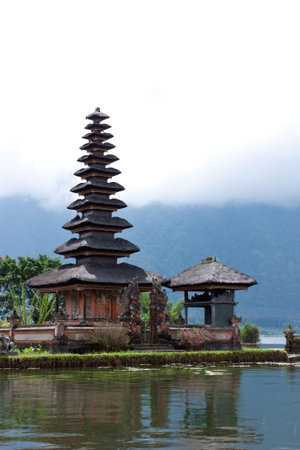 Lake Bratan, high up in the central mountains of Bali, is famous for its lakeside templeの写真素材