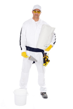 worker in white overalls holding a bucket trowel tools package on a white backgroundの写真素材