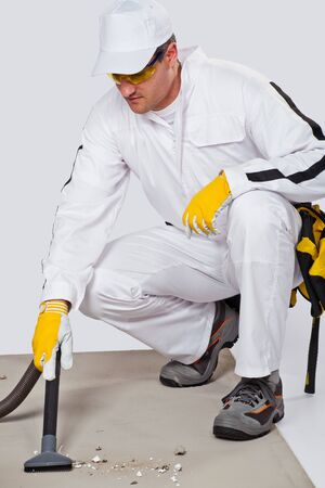 Cleaning cement floor with vacuum cleanerの写真素材
