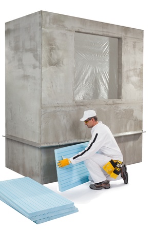 Worker setting up an insulation panelの写真素材