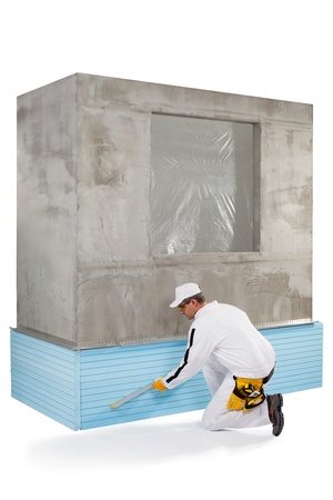 Worker measuring with a level toolの写真素材