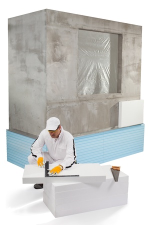 Worker measuring an insulation panelの写真素材