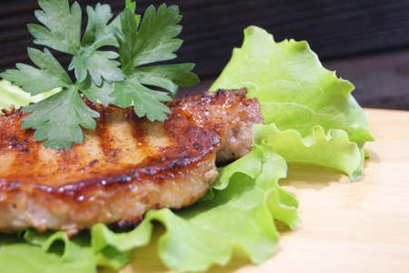 Beef steak on lettuce leaves.の写真素材