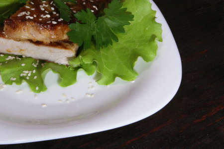 Beef steak on lettuce leaves.の写真素材