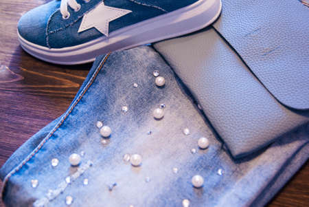 Women's clothing and accessories. Jeans, purse and shoes.の写真素材