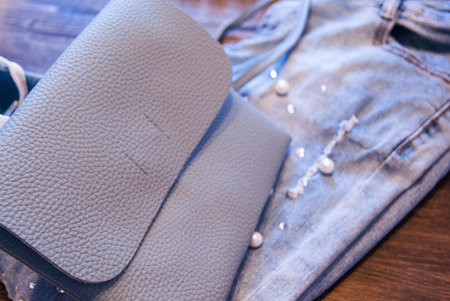 Women's clothing and accessories. Jeans, purse and shoes.の写真素材