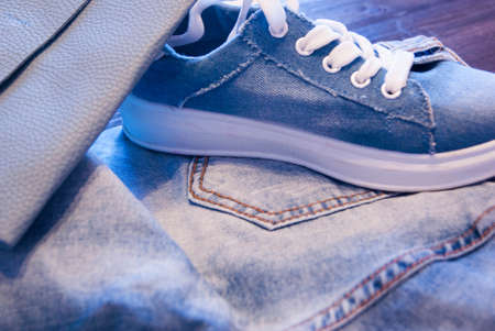 Women's clothing and accessories. Jeans, purse and shoes.の写真素材