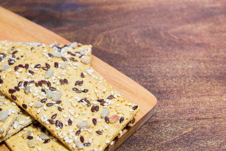 Cookies made from oat flakes with seeds of sesame, flax and sunflower seeds. Very tasty and healthy product for people who are on a diet.の写真素材