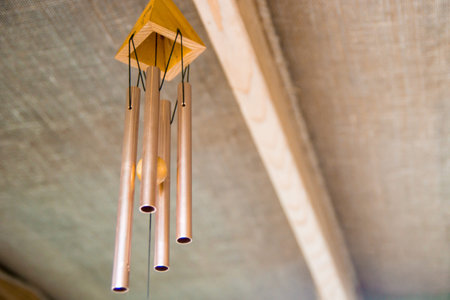 A wind chime in the roof of the restaurant in Thailandの写真素材