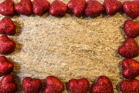 Wedding rings on a natural stone with inclusions of native gold. Offer hands and heartsの写真素材