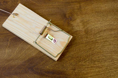 Mousetrap. Do not fall for the bait. Always think about the consequencesの写真素材