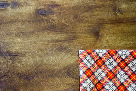 Kitchen towel on a wooden table. The background on the kitchen theme.の写真素材