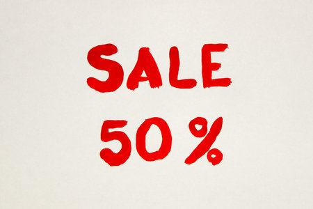 The inscription on a white sheet of paper. Black Friday. A 50% discount. Sale. The inscription...