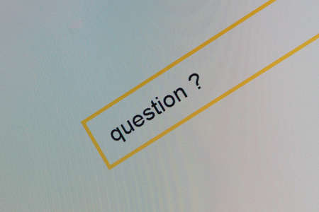 Photo of computer monitor where a person is looking for answers to your questions.の写真素材