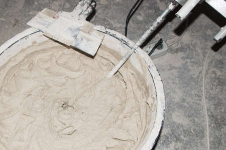 Preparation of the mortar for interior and exterior use. Ready mix mixed building tool. Tool for drawing on a wall.の写真素材
