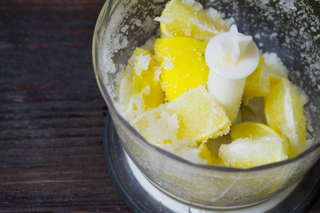 The lemon in the blender. Cooking lemon drink.の写真素材