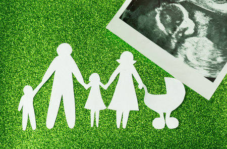Paper image of happy families who are expecting another child.の写真素材