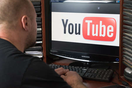 Belgorod, Russia - December 11, 2017: Man uses Youtube. A white man sitting at the computer. Youtube page ...のeditorial素材