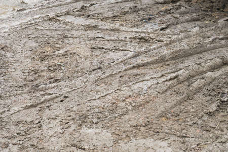 Tire tread of car wheels in the mud.の写真素材