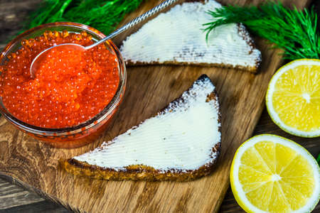 Red caviar on sandwiches. Expensive and healthy food.の写真素材