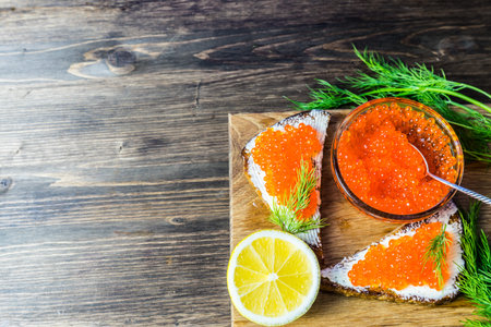 Red caviar on sandwiches. Expensive and healthy food.の写真素材