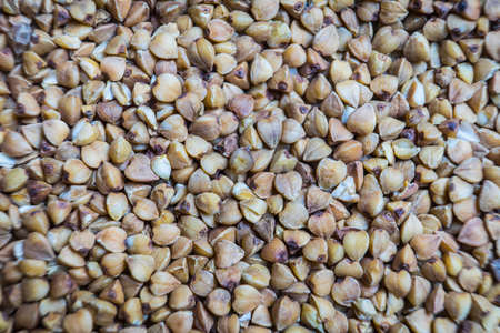 Buckwheat von. Raw buckwheat grains close-up. Macro background.の写真素材