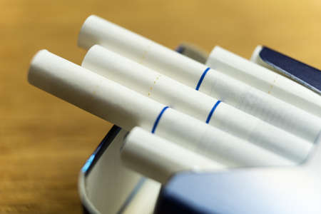 Photo of a pack of cigarettes close-up. Cigarettes with white filter.の写真素材