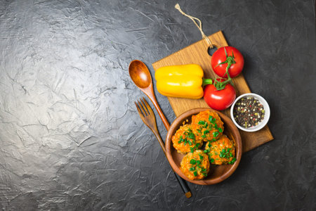 Meatballs with rice and meat in a wooden dish. Place for your text...
