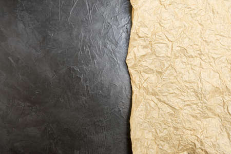 Crumpled paper on a black background. Place for your text...の写真素材