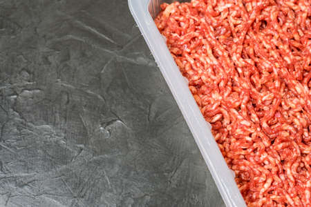 Minced meat on a black background.の写真素材