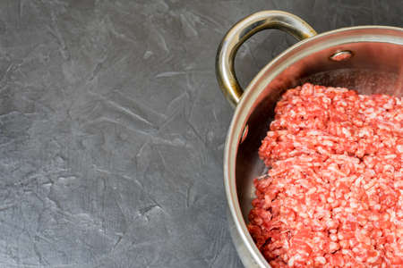 Minced meat on a black background. Place for your text...の写真素材