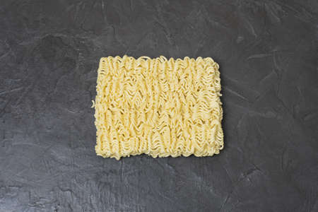 Egg noodles on a black background. Place for your text...の写真素材