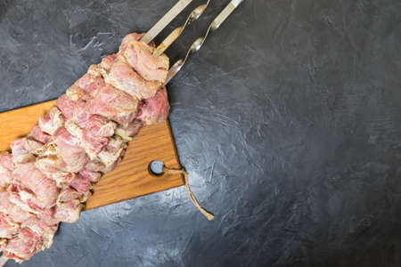 Raw shish Kebab on skewers. Place for your text...の写真素材