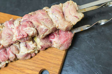 Raw shish Kebab on skewers. Place for your text...の写真素材