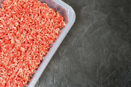 Minced meat on a black background. Place for your text...の写真素材