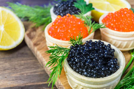 Festive sandwiches with red and black caviar. Healthy and tasty food.の写真素材