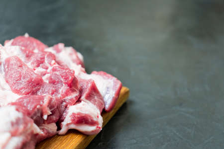 Raw meat on a cutting board. place for your text.の写真素材