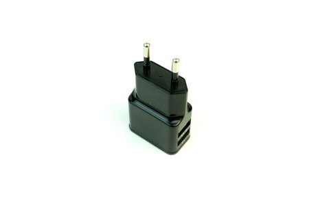 The charger for the phone. Photo on white background.