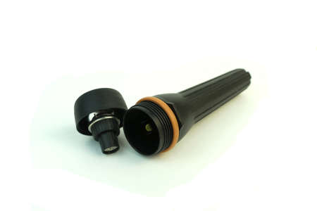 The electric flashlight. Plastic. Photo on white background.の写真素材