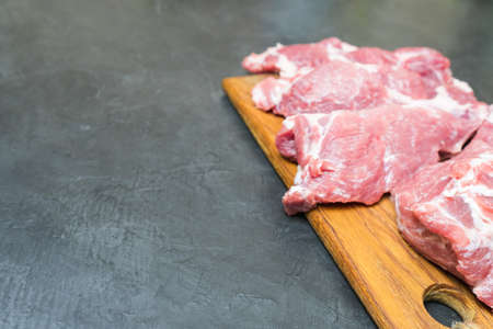 Raw meat on a cutting Board. place for your text...の写真素材