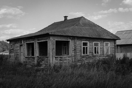Old abandoned wooden house. Black and white photo.の写真素材