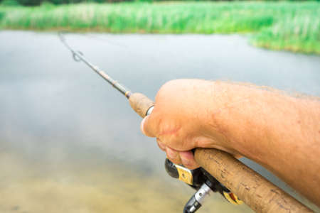 Spinning fishing is an exciting activity. Sport fishing.の写真素材