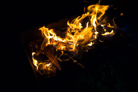 To ignite the grill night for grilling the skewers.