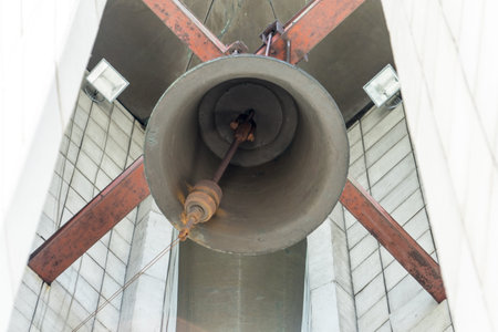 The old bell is fixed under the roof of the chapel.