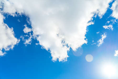 Photo of blue sky with bright sunの写真素材