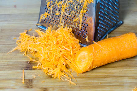 Grated carrots. Place for your text. Preparation of vegetarian dishesの写真素材