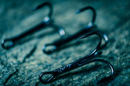 The fishing hook is photographed close-up. Place for your text.の写真素材