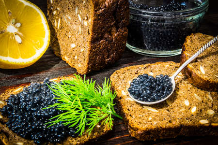 Sandwiches with caviar. Preparation of sandwiches. Place for your text.の写真素材