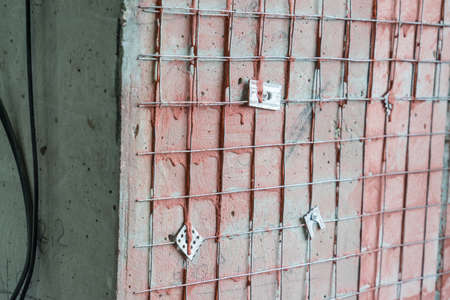 Metal welded mesh for better adhesion of plaster on the walls. Metal welded mesh for better adhesion of plaster on the walls.の写真素材